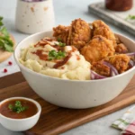 Finished homemade KFC bowl recipe served with extra gravy and a garnish